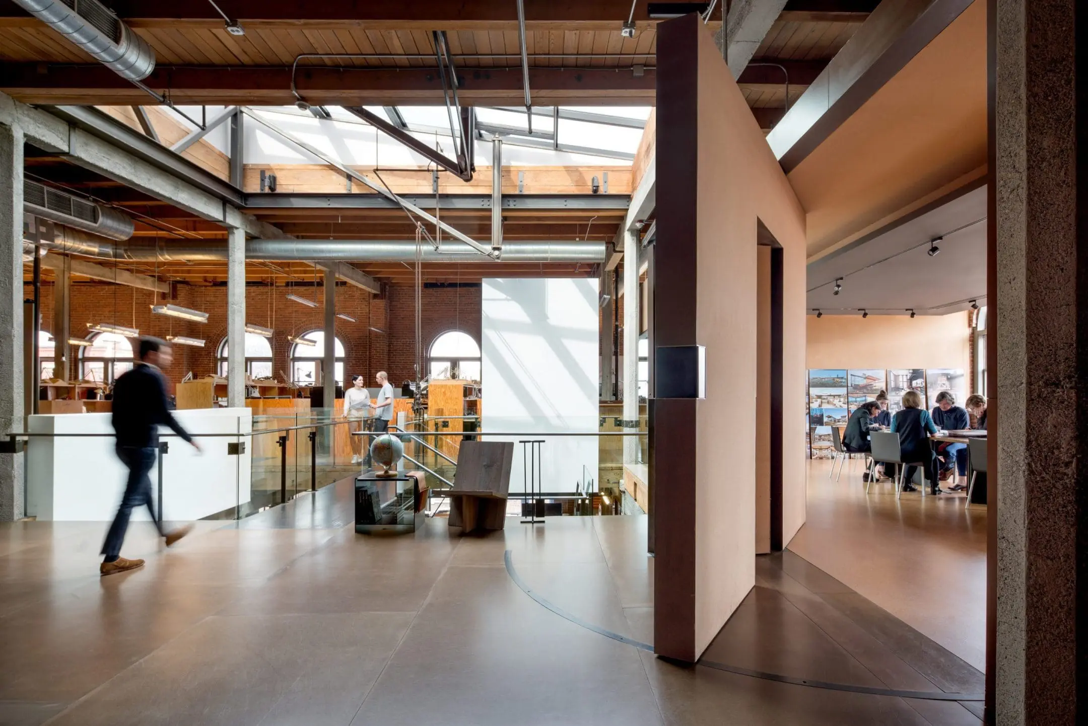 Olson Kundig’s Seattle office with an open atrium, steel staircase, and skylight